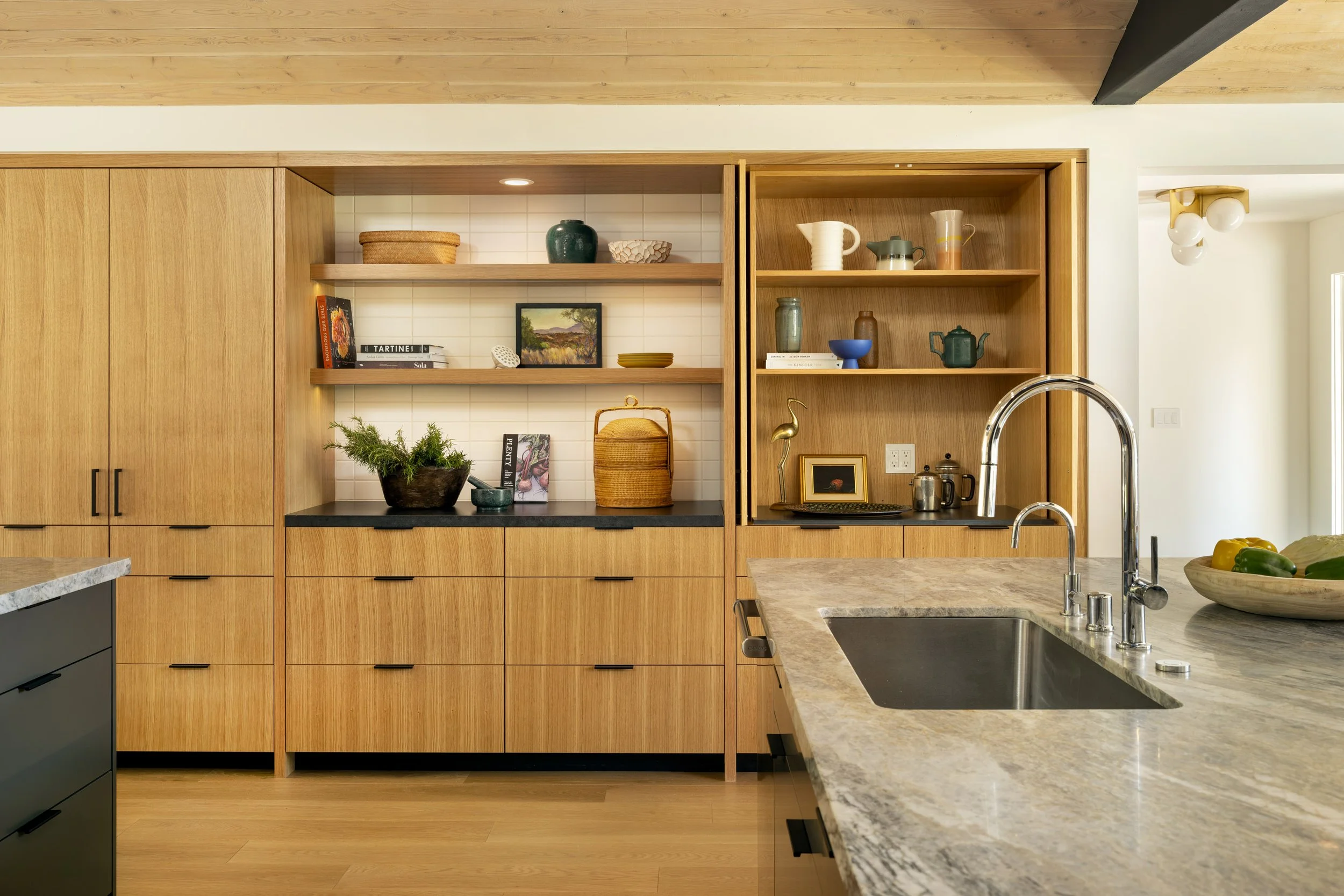 Kitchen with granite counter top and brown cabinets